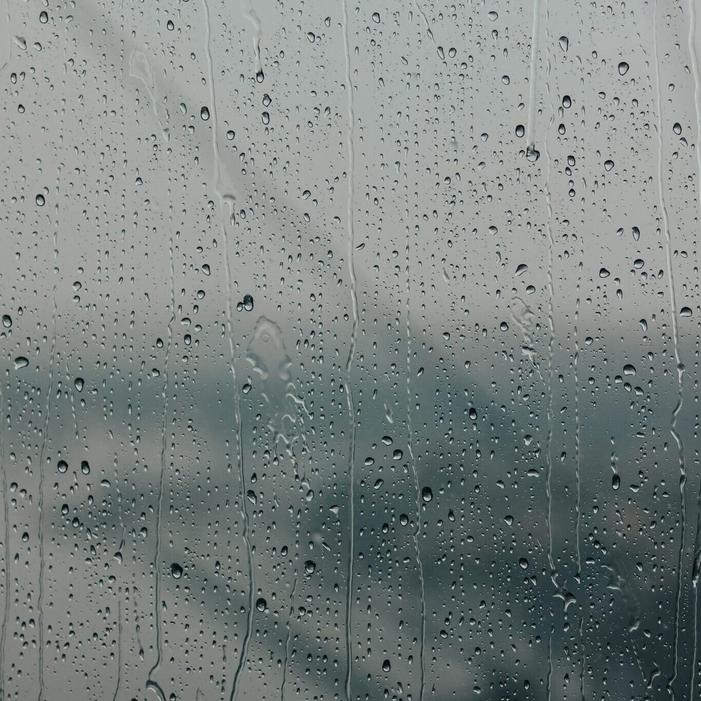 rain and wind causing roof damage to home